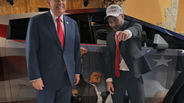 Adin Ross stand with Trump in front of a Cybertruck